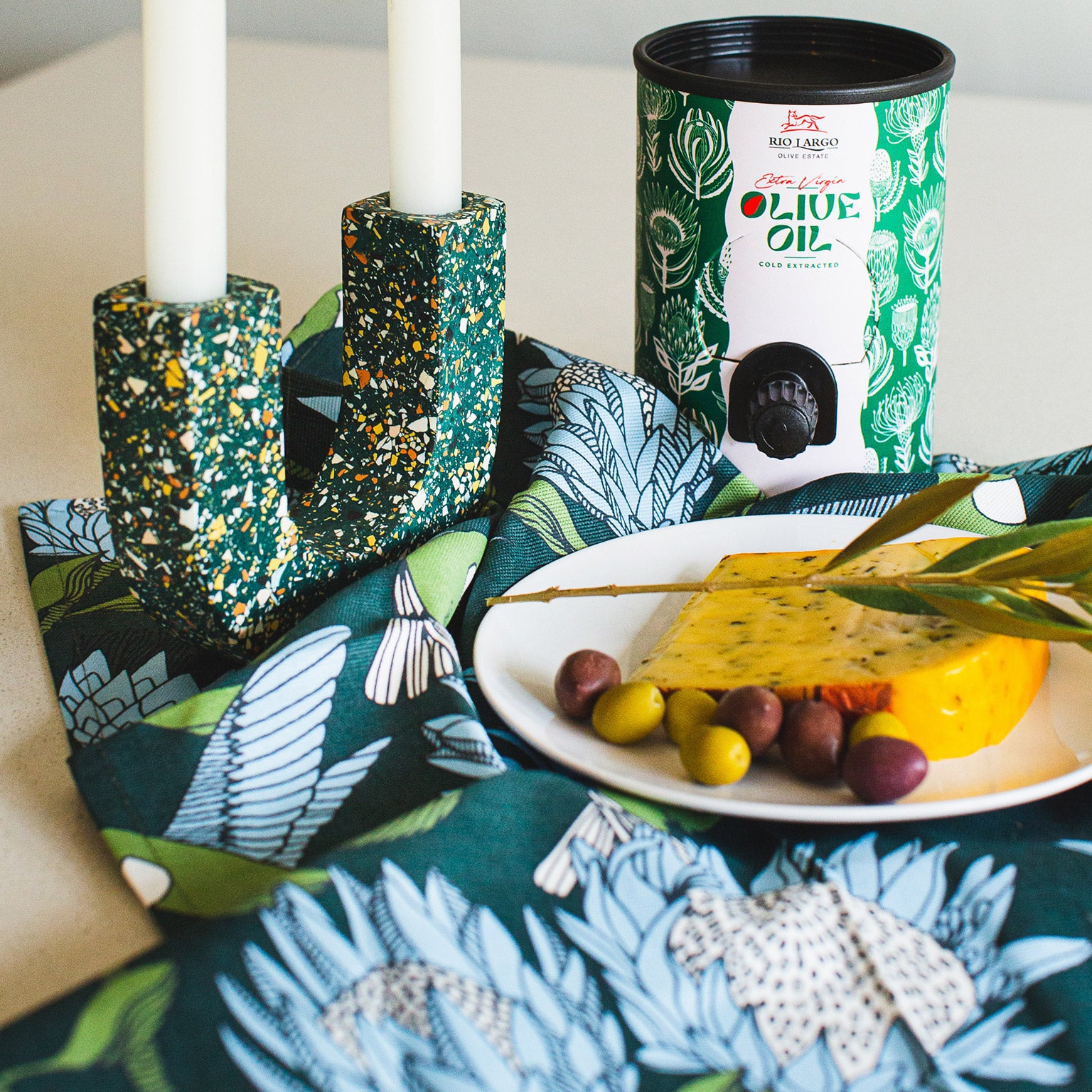 Essence of Mihle Box (Close Up with Cheese & Olives on Plate)