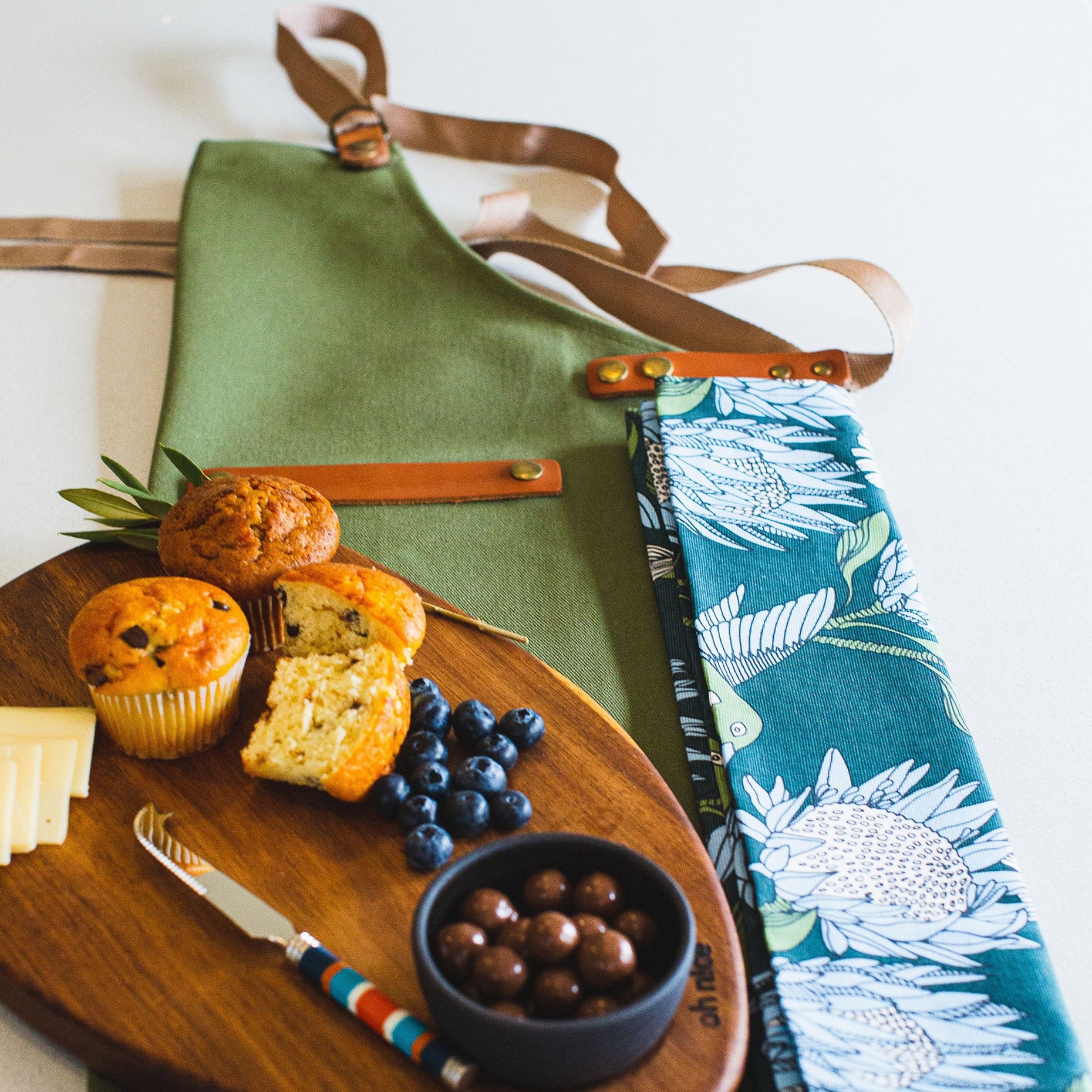 Enhle INDLU Box (Pieter de Jager Canvas & Leather Apron, OH Nice Tapas Board, PaulaG Sea Boat Blue Cheese Knife, A Love Supreme Tea Towel with Food)
